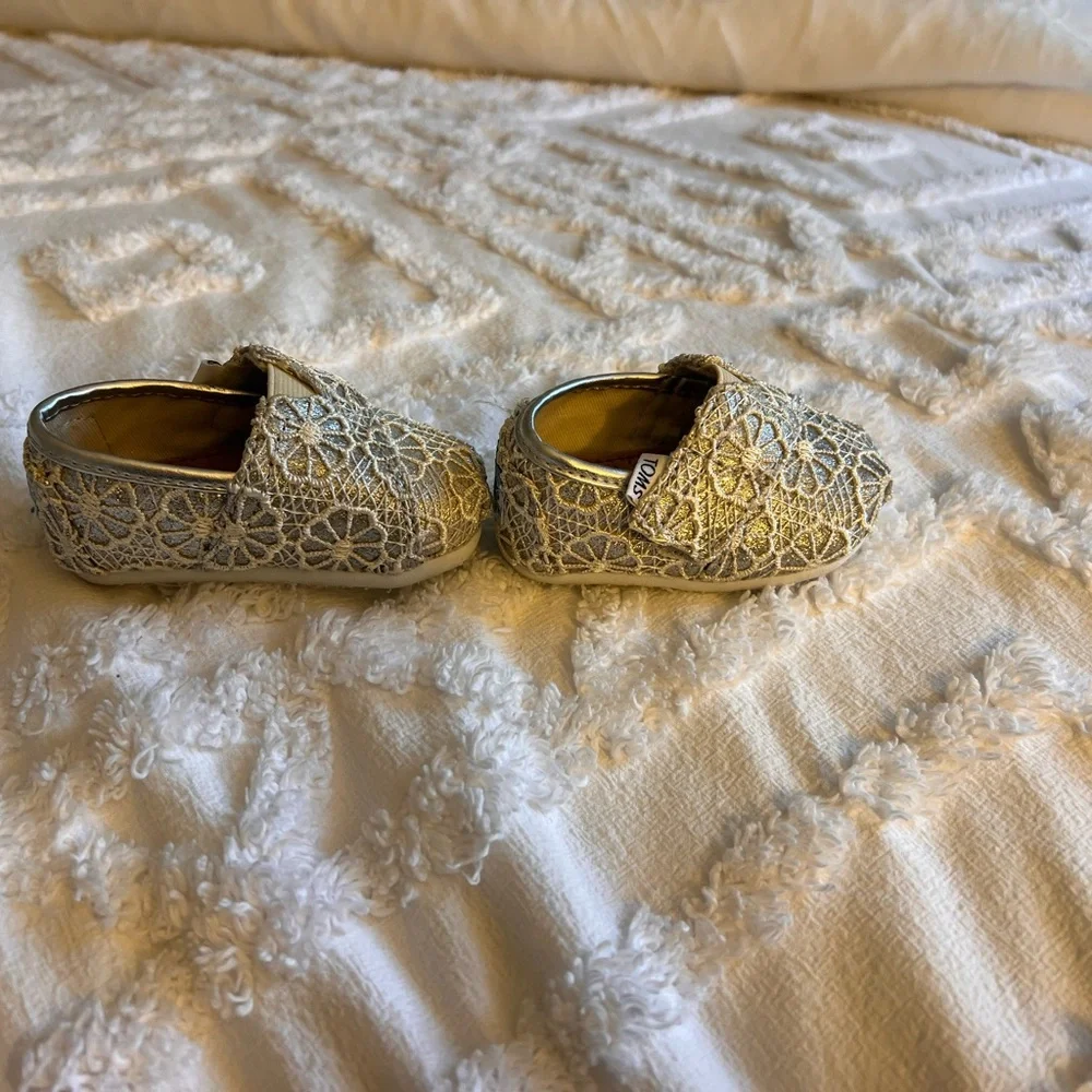 TOMS Tiny Moccasins in Shimmering Silver